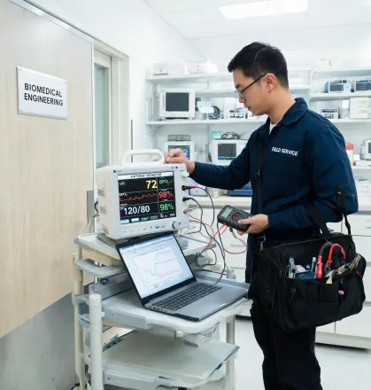 Field engineer servicing monitor